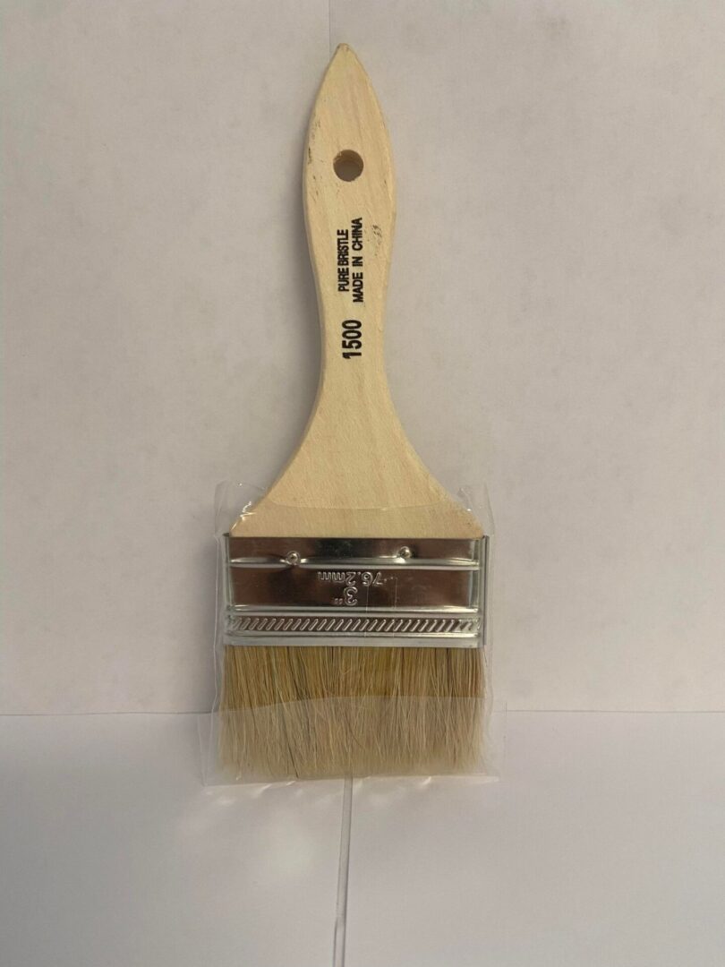 A 3 inch 76.2 mm paint brush with wooden handle