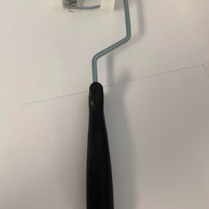 A long paint roller with a black handle