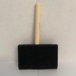 A wide and short foam paint brush