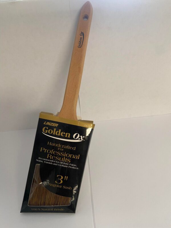 A 3 inch paint brush with wooden handle