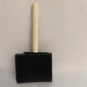 A black foam brush with a small wooden handle