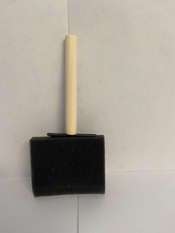 A black foam brush with a small wooden handle