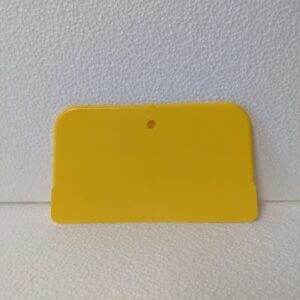 A basic plastic paint scraper