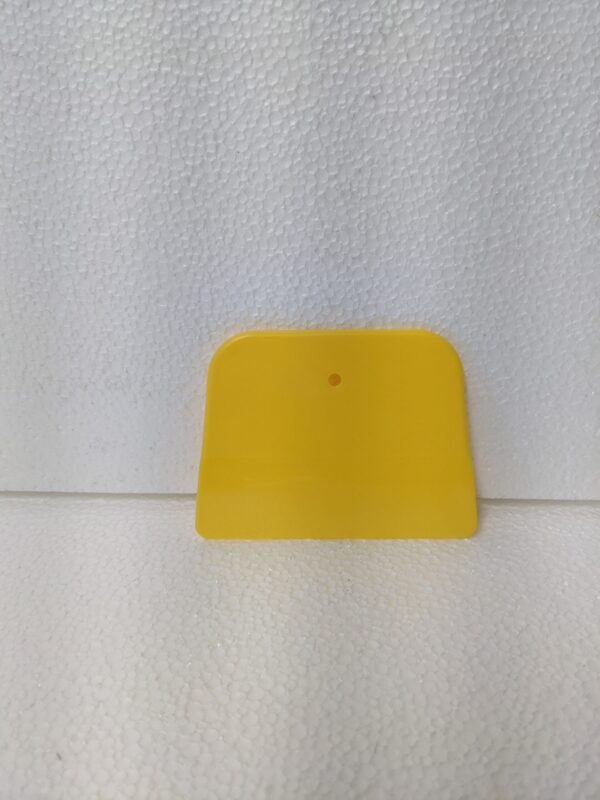 A regular plastic paint scraper image