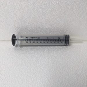 A plastic plunger style syringe