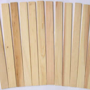 A pack of 12 wooden paint sticks