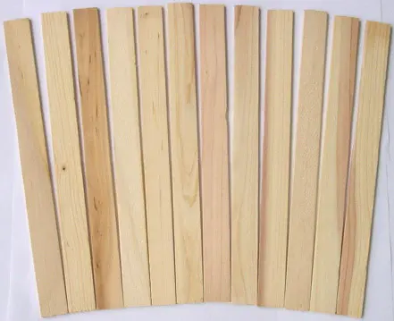 A pack of 12 wooden paint sticks