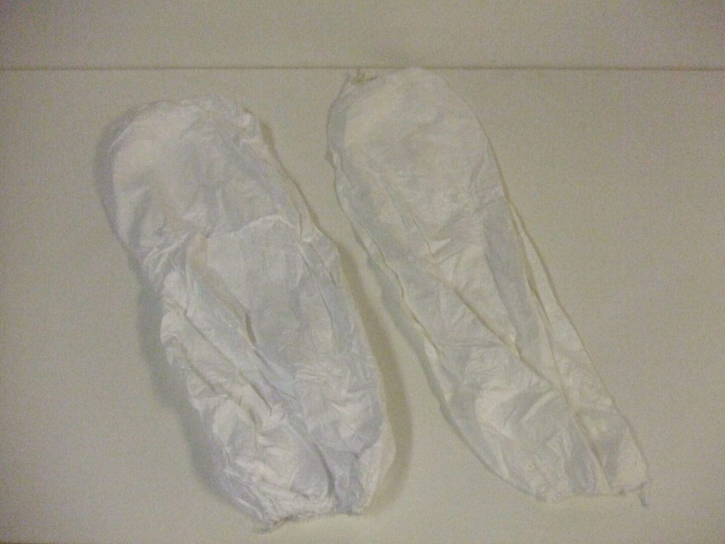 A pair of white painting arm sleeves